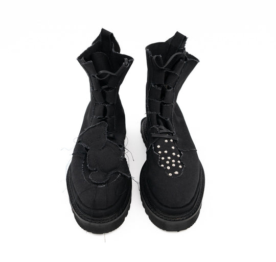Teddy Vegan black canvas lace-up booties by Mihaela Glavan, front view showing the different teddy bear and stud designs on the two boots.