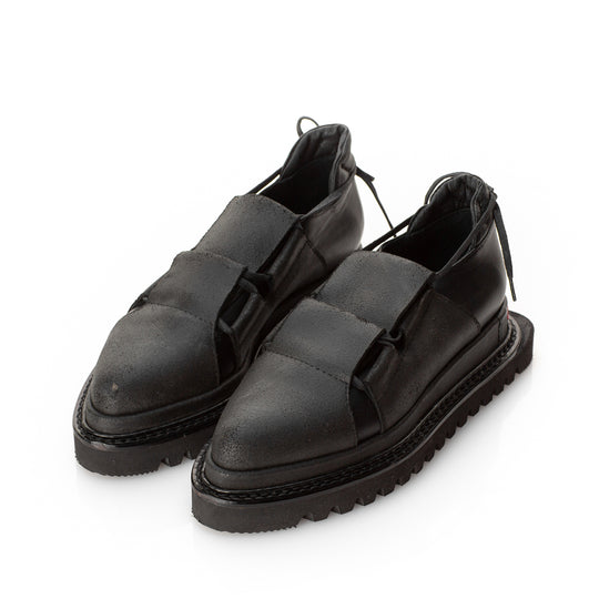 Black leather flat platform shoe