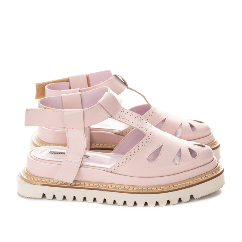 Pink leather covered flat platform shoes