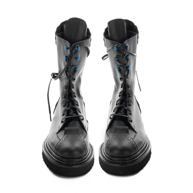  Handcrafted leather boots with black geometric sole