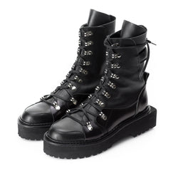 Black leather laced up boots with geometric sole
