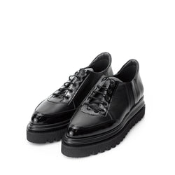 Black leather flat platform shoes with black patent leather detail