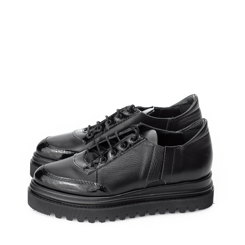 Designer shoes with black leather tube flat platform and black sole