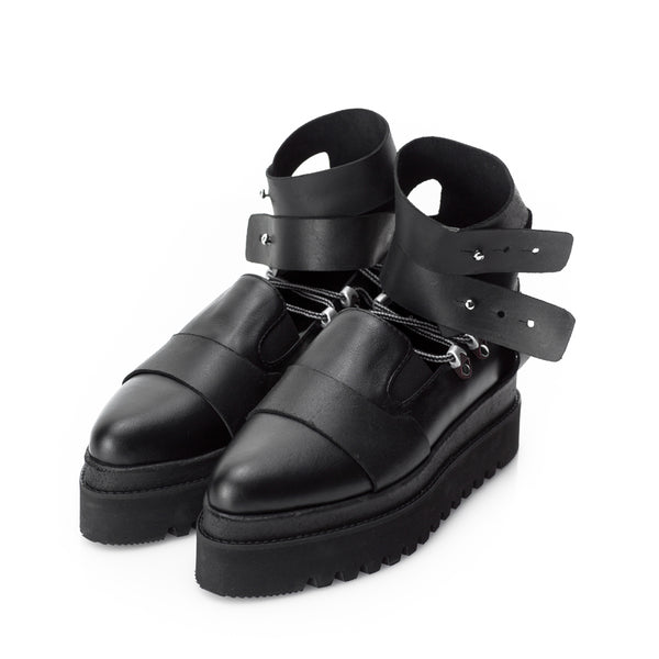 Black leather shoes with double ankle straps