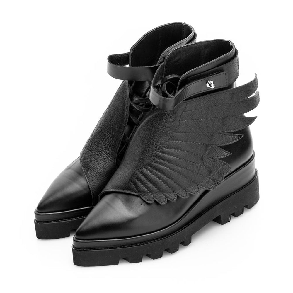 Black leather flat platform boots with quilted flap detail