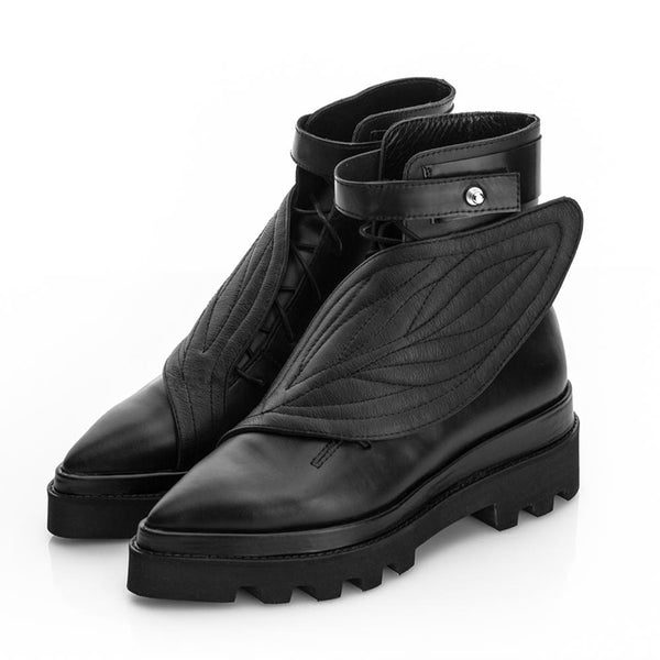 Flat platform black leather boots with leather leaf detail