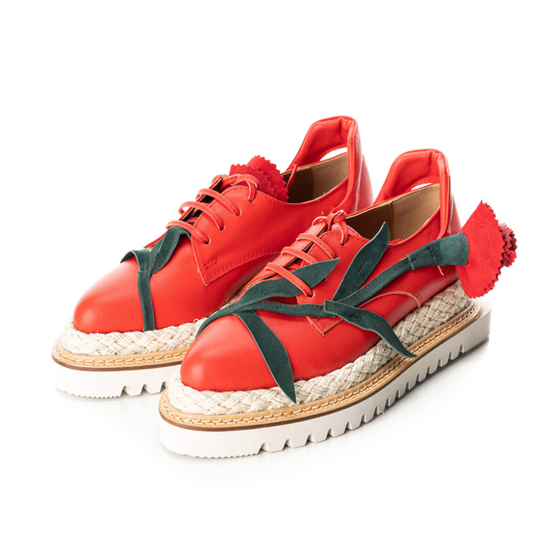 Red leather designer shoes with red and green suede detail