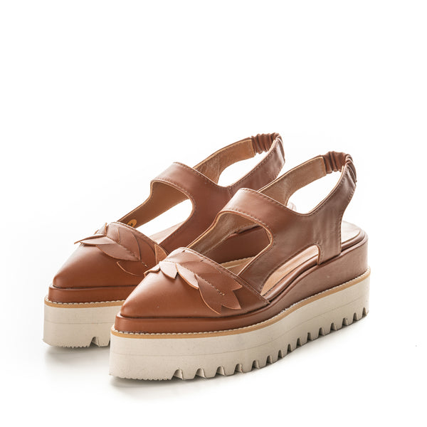 Brown leather open back shoes with floral inspiration details