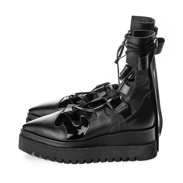 High-quality black boots with creative cut-out elements