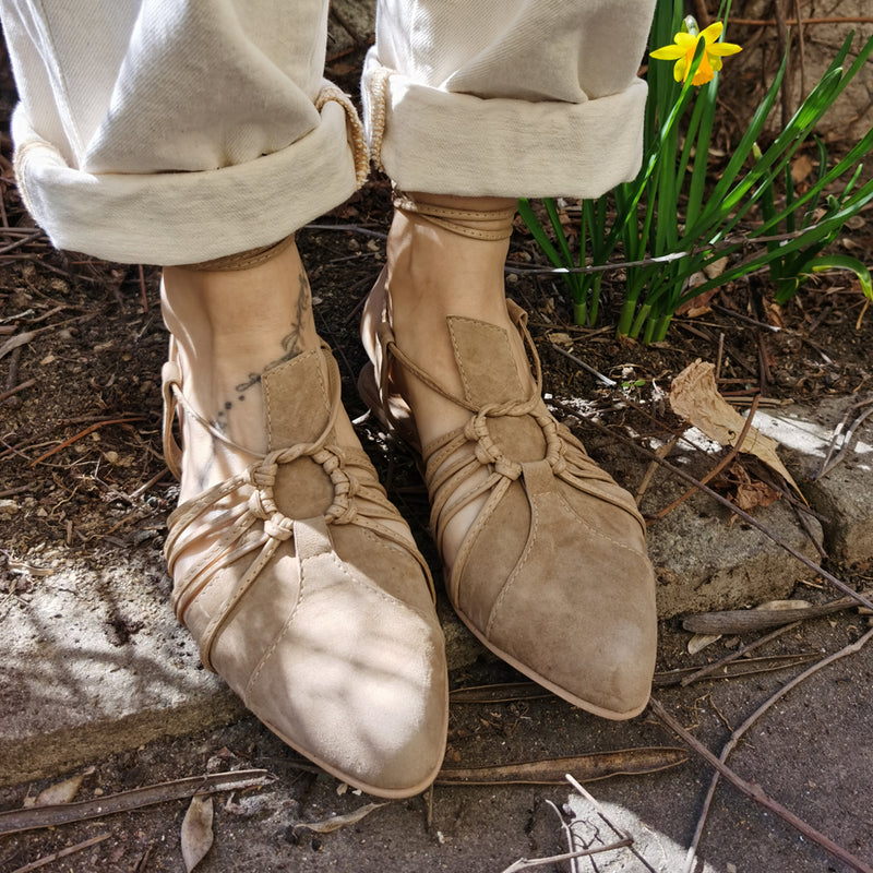 Fashionable beige ballerinas with laces